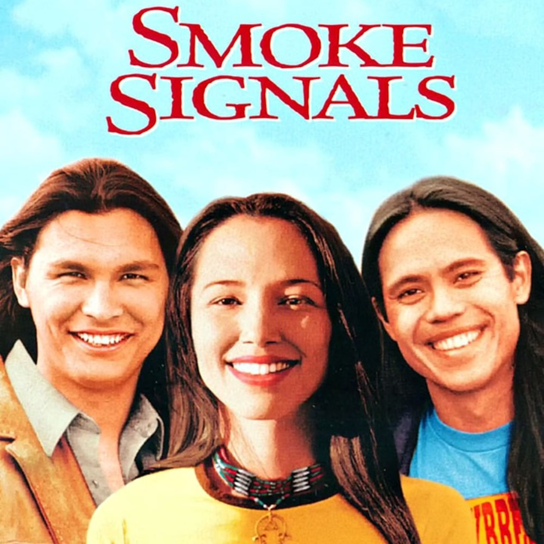 movie cover of smoke signals. Three people smiling at the camera